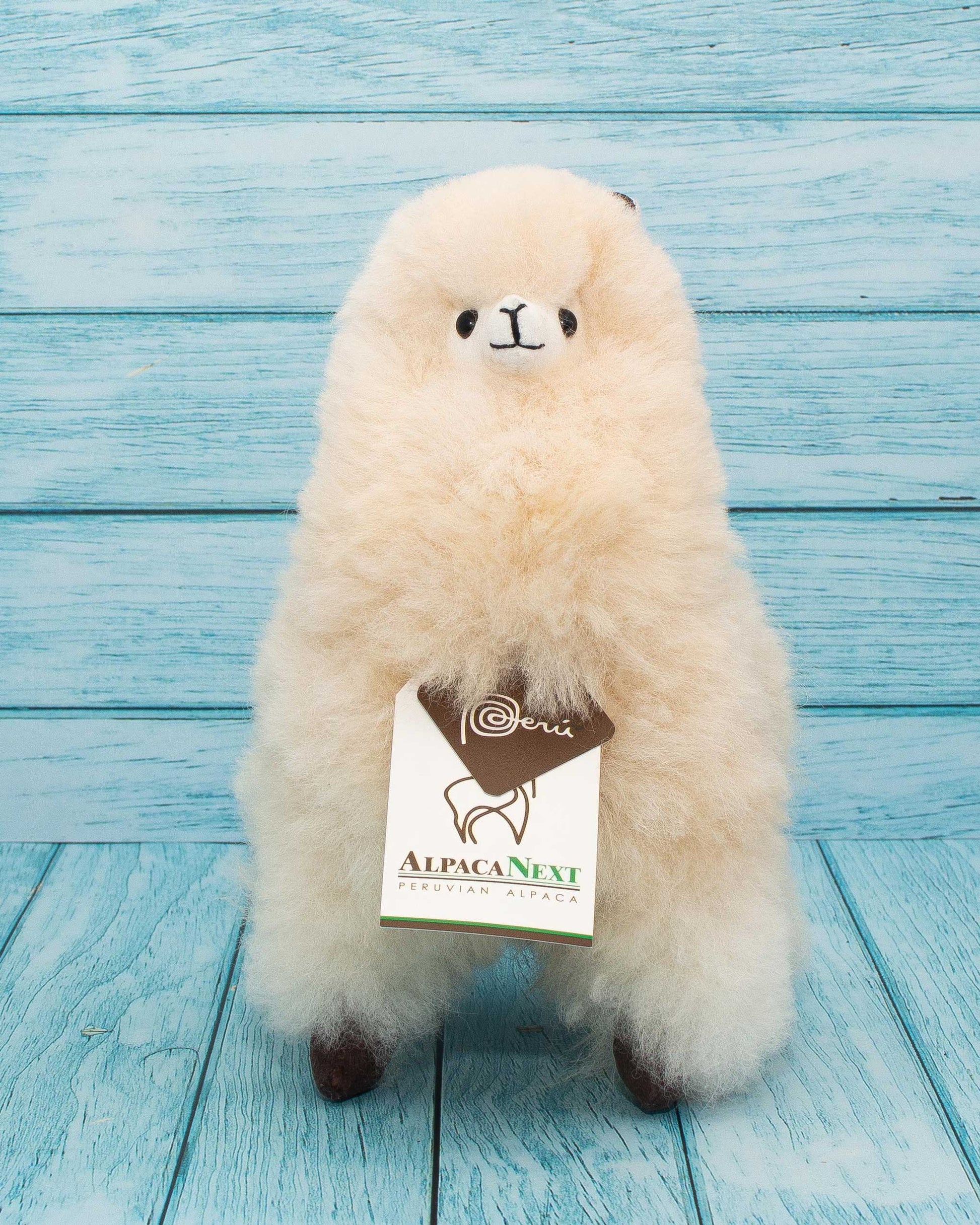 Soft alpaca stuffed animal. Beige, 9 inches. Charming smile