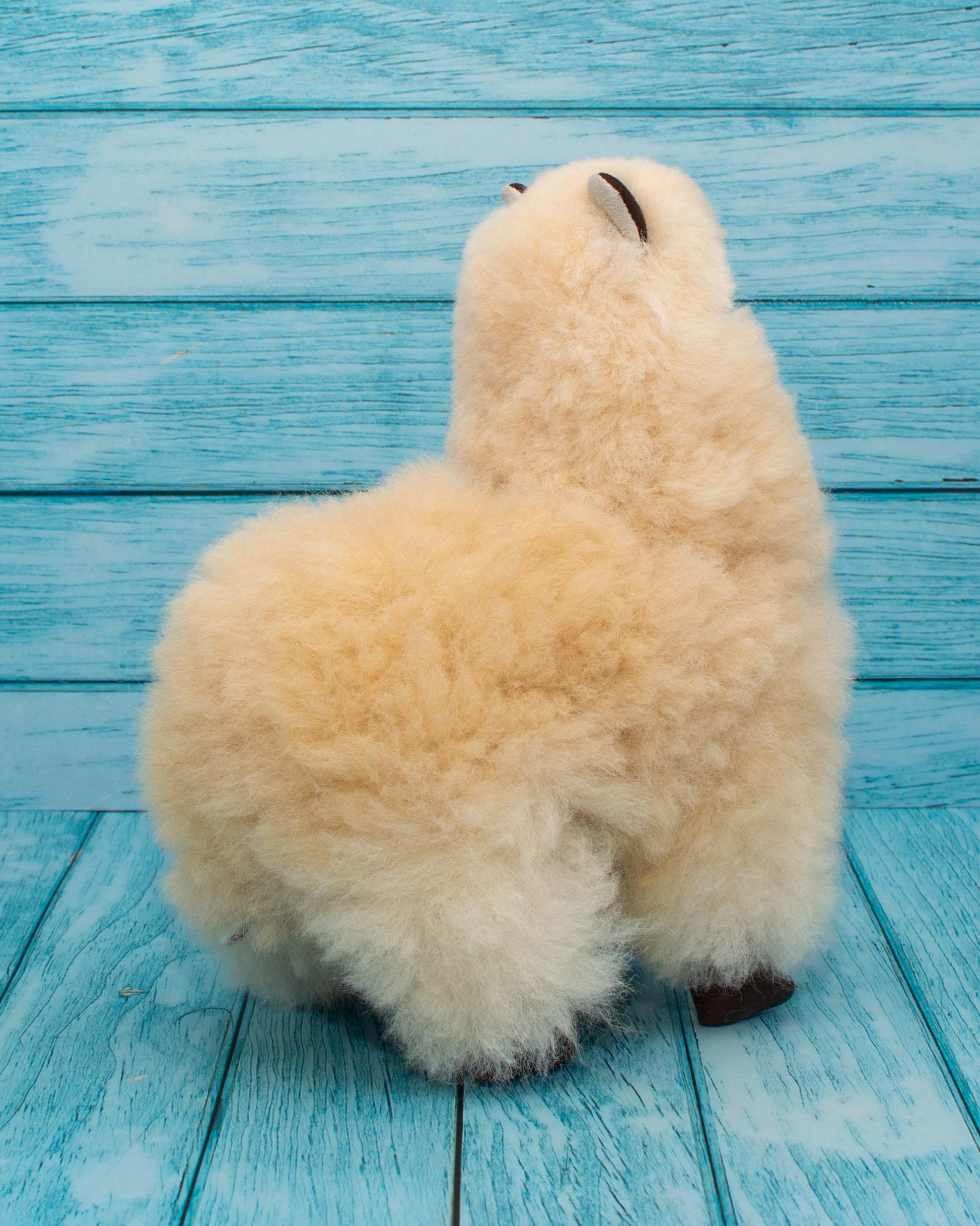 Soft alpaca stuffed animal. Beige, 9 inches. Can't help but hug it