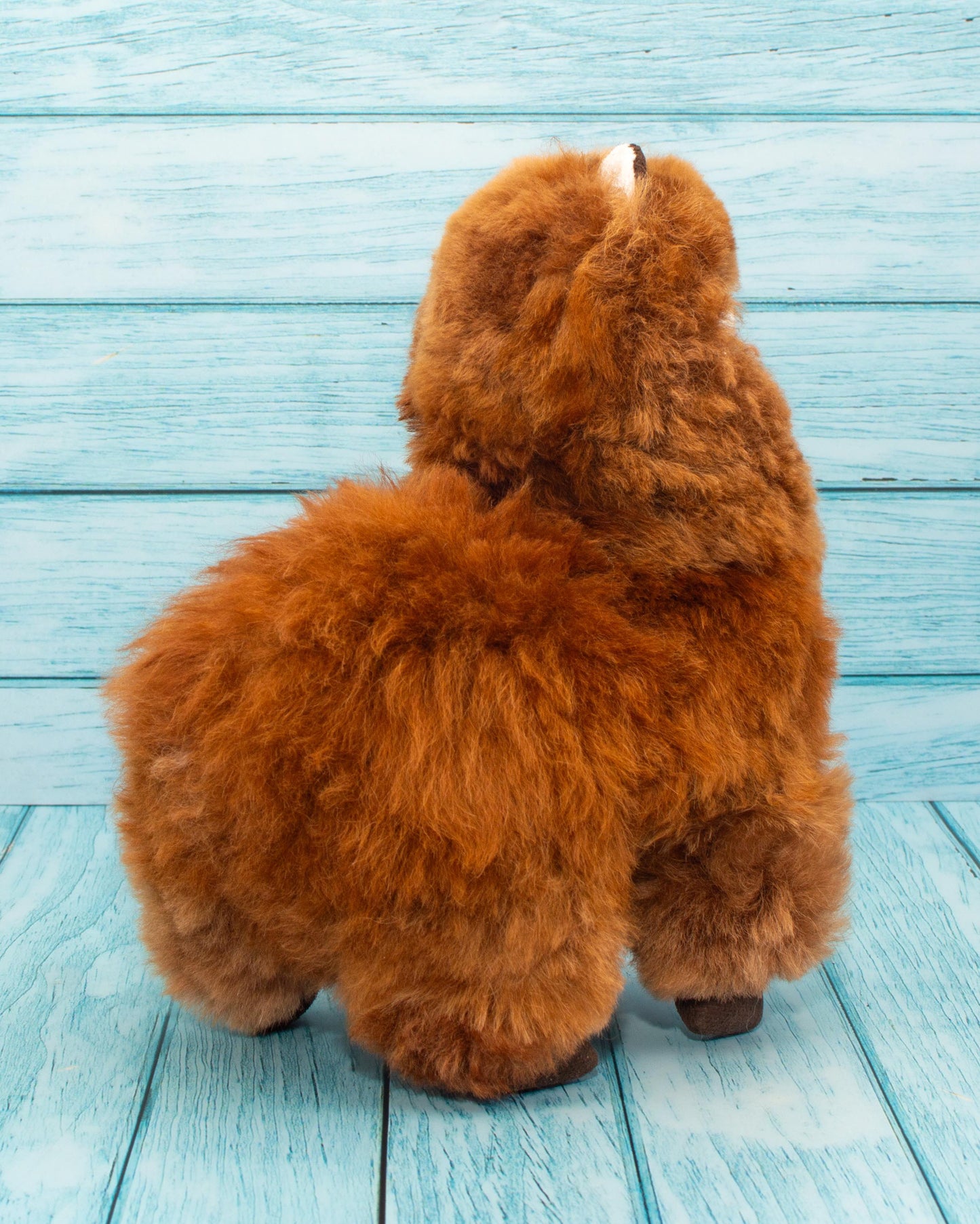 Soft alpaca stuffed animal. Beige, 9 inches. Running towards you