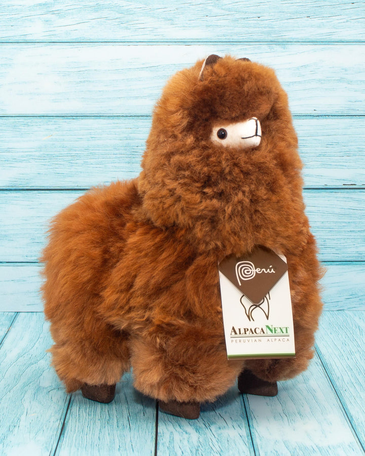Soft alpaca stuffed animal. Brown, 9 inches.