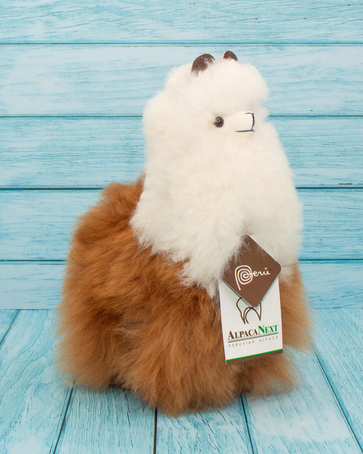 Soft alpaca stuffed animal. Brown and white, 9 inches.