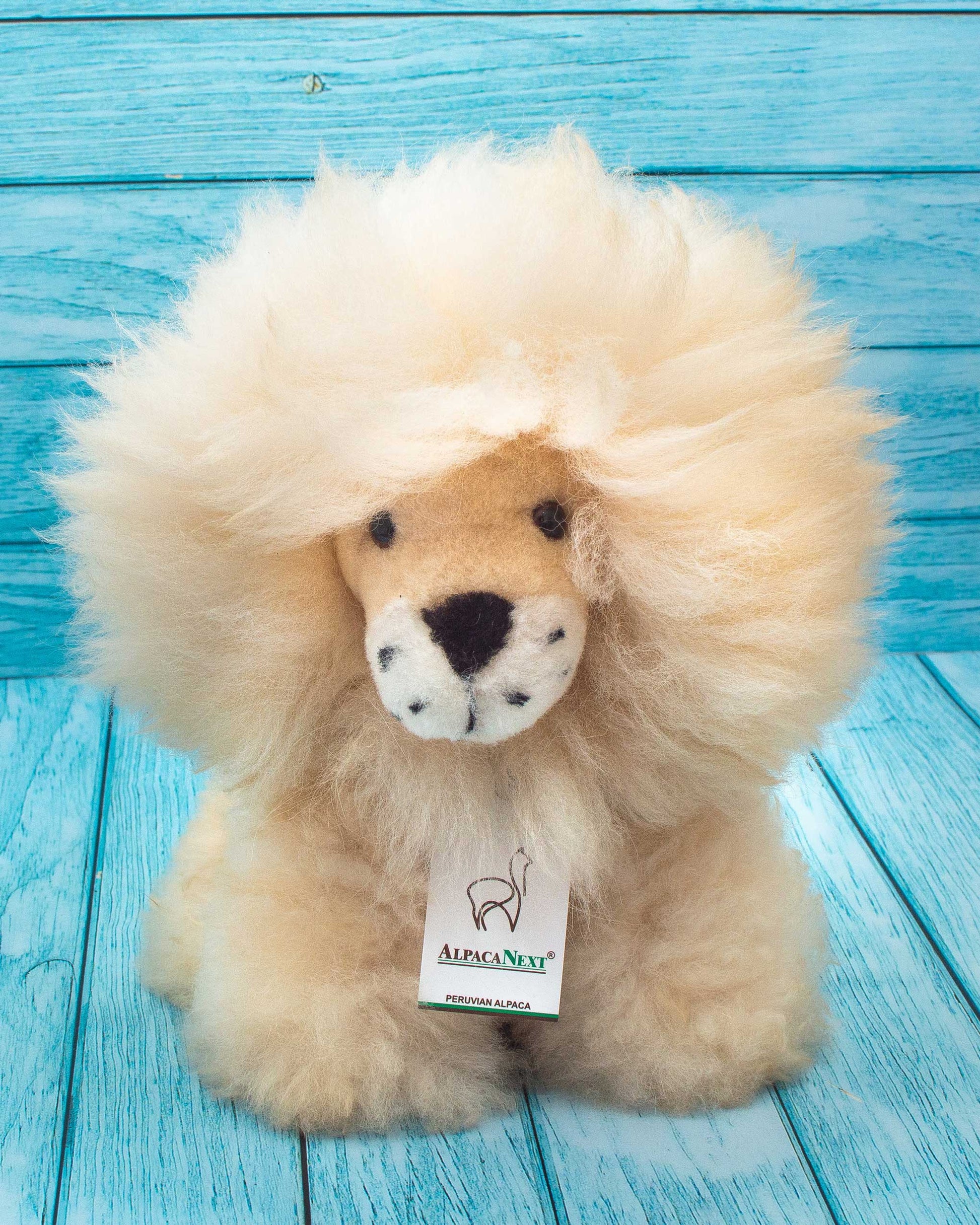 Soft stuffed lion handmmade on natural alpaca wool. Fluffy and cuddly