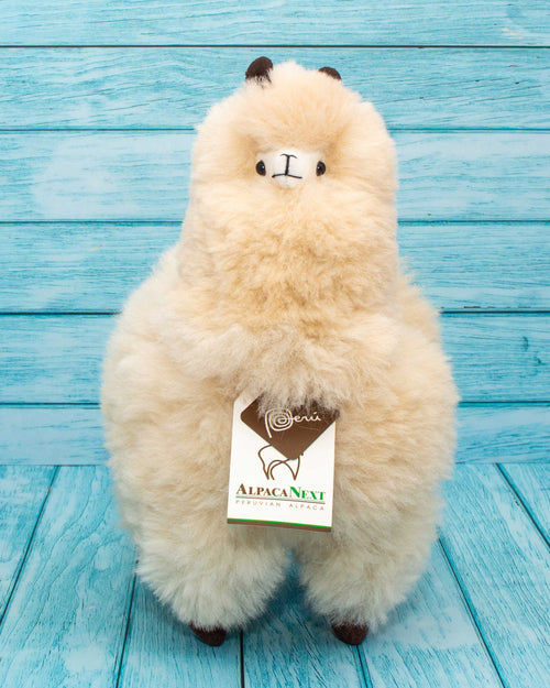 soft alpaca fur stuffed animal. Beige 12 inches. Front view