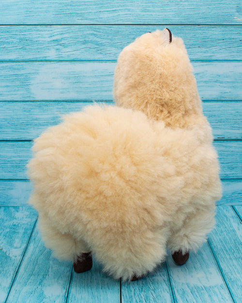 soft alpaca fur stuffed animal. Beige 12 inches. Back view