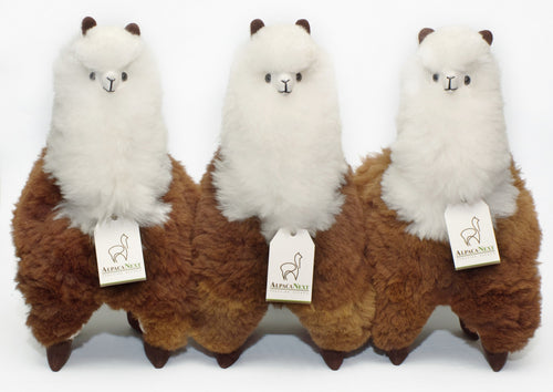 Soft alpaca fur stuffed animal. Brown and white, 18 inches.  3 alpacas waiting for you.