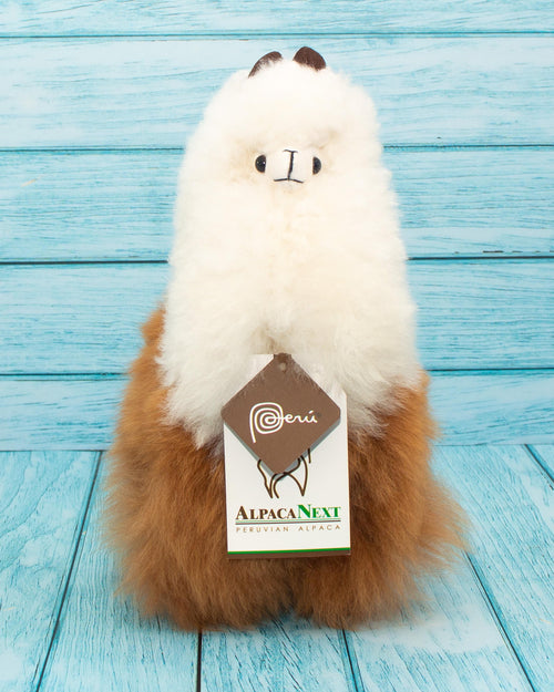 Soft alpaca stuffed animal. Brown and white, 9 inches. Charming eyes