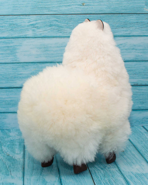 Soft alpaca fur stuffed animal. White, 12 inches. Back view