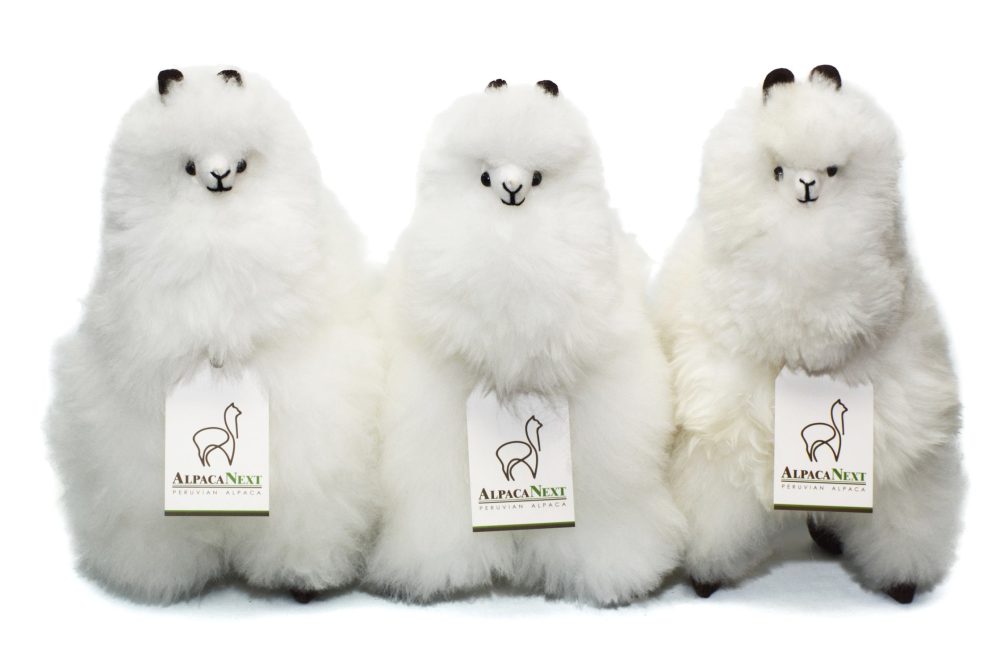 Collection of AlpacaNext premium baby alpaca fur figures in white 12 inch luxury gift display