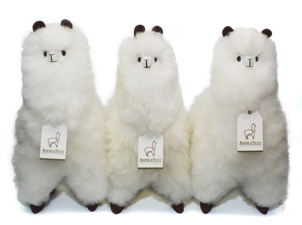 Collection of AlpacaNext premium baby alpaca fur figures in brown and white 18 inch luxury gift display
