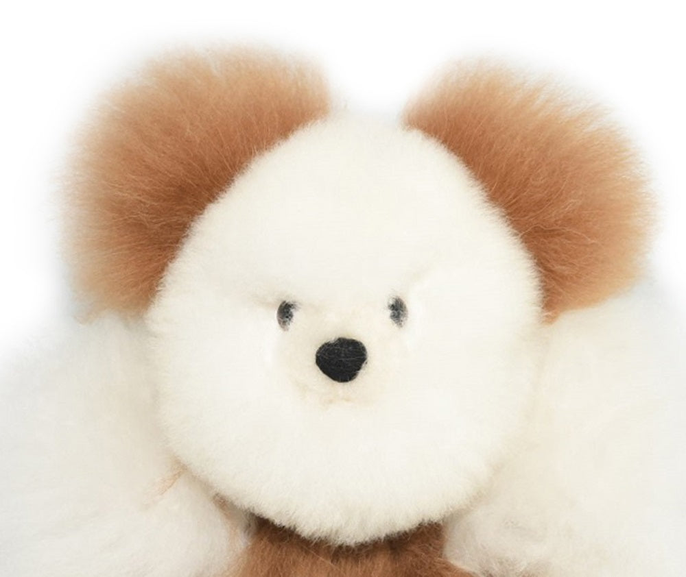 Close up of the cute face and ultra-soft baby alpaca wool on an AlpacaNext 9 inch handmade teddy bear.