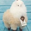 Soft alpaca stuffed animal. Beige and white, 9 inches.