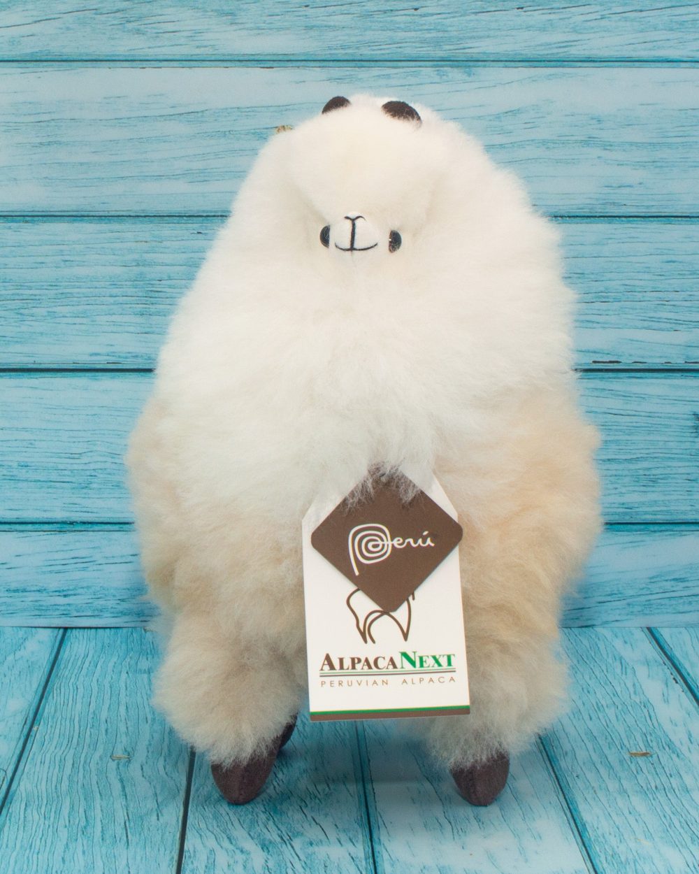 Soft alpaca stuffed animal. Beige and white, 9 inches. Front view