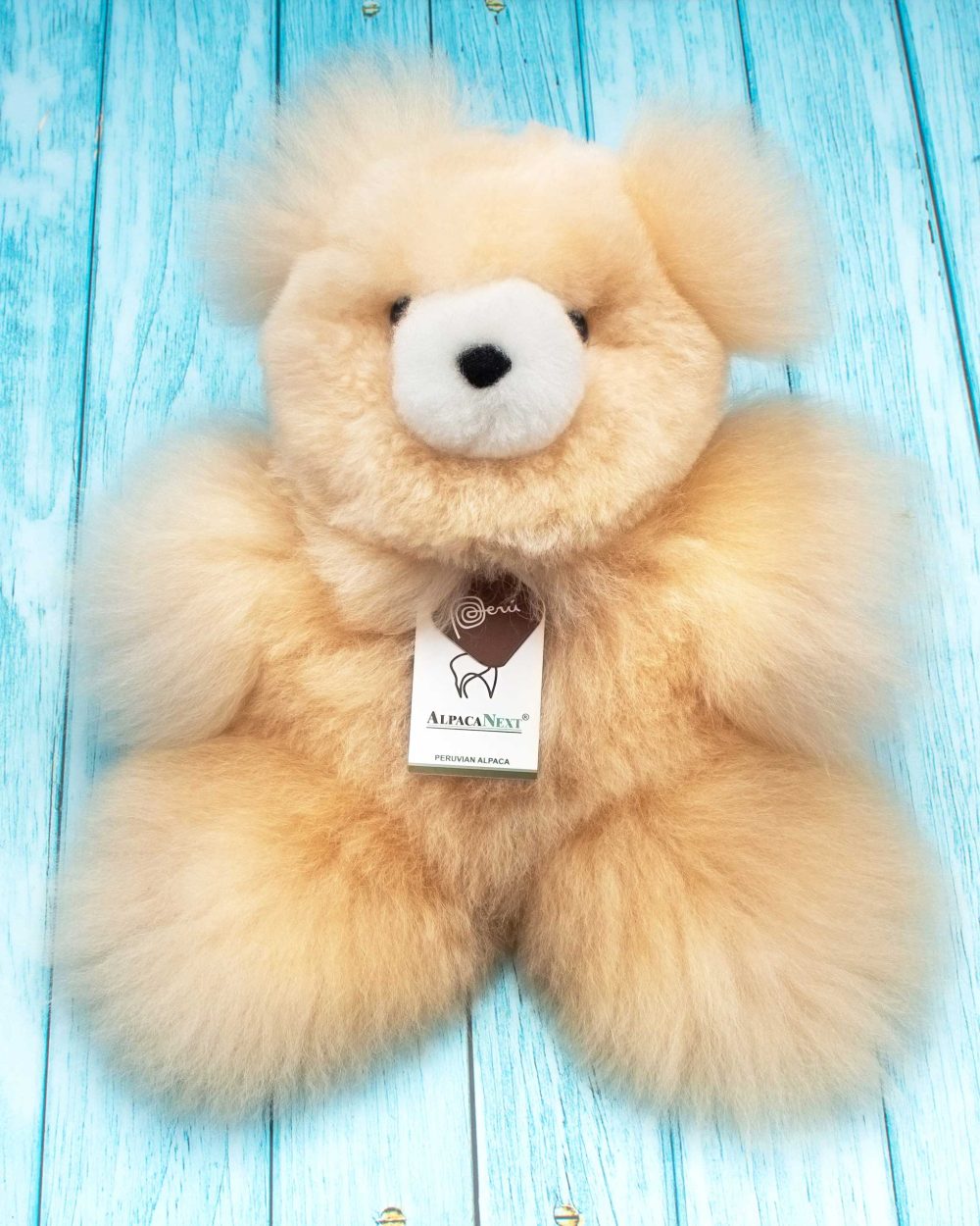 Front view of the AlpacaNext 12 inch beige teddy bear showing its incredibly soft and huggable texture
