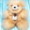 Front view of the AlpacaNext 12 inch beige teddy bear showing its incredibly soft and huggable texture